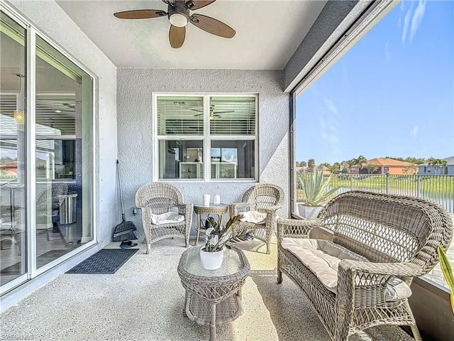 Sunroom / solarium featuring ceiling fan