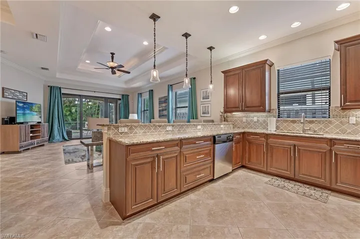 Kitchen with stainless steel appliances, granite counters and wood cabinetry