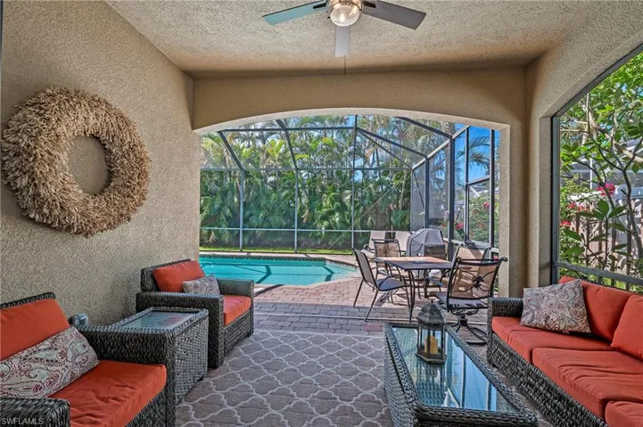 View of lanai featuring an outdoor covered area with pool view