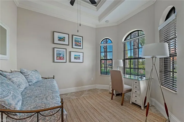 Den/Office/Flex Bedroom with a raised ceiling, crown molding, and ceiling fan