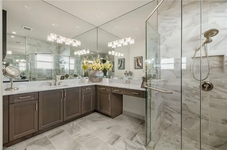 Other side of primary bath. Spacious and bright!