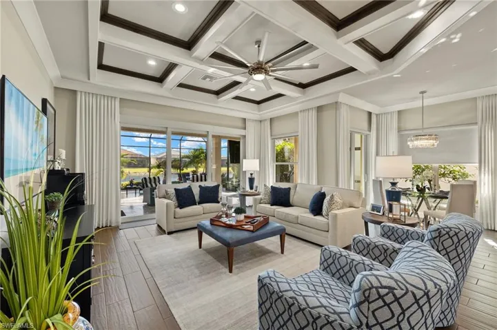 See that view of the lake? YOU SEE IT UPON ENTRY!!! Spacious great room, coffered ceiling, and open floor plan is a reason this GL Chandon model is a favorite in VB.