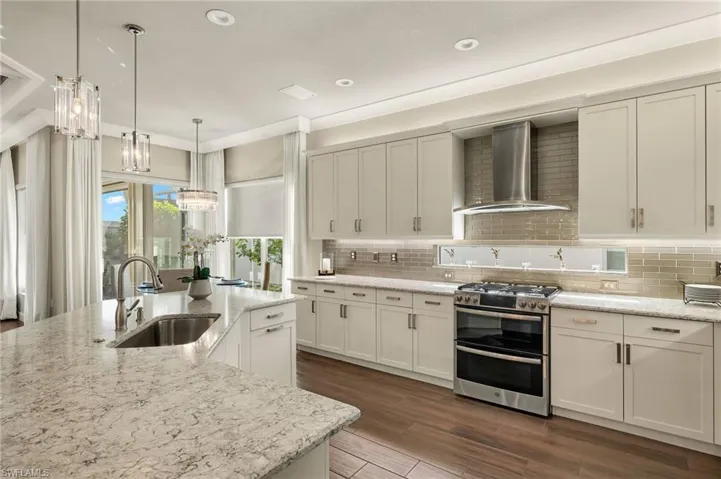 A cook's dream! Lots of counterspace to work PLUS you don't miss a thing while cooking with this wide open floorplan!