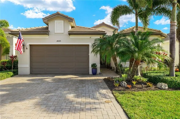 Tankless hot water heater, epoxy garage floor, 1 electric + 1 stationary overhead storage racks are in this garage....