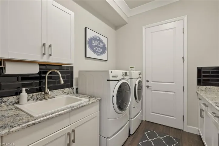 Extra cabinets allow for folding space in this large laundry room!