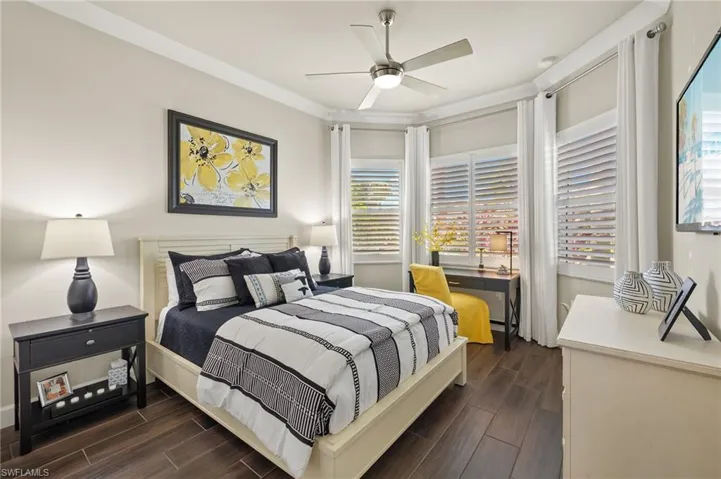 Second bedroom is located in front of home and showcases 3 windows! Storm protection windows and doors throughout home!