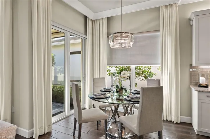 Breakfast room is bright and cheery with its 2 windows and sliding doors to the amazing living space on the extended lanai.