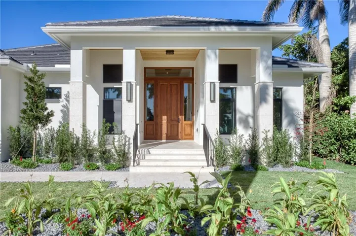 Property entrance with stucco siding