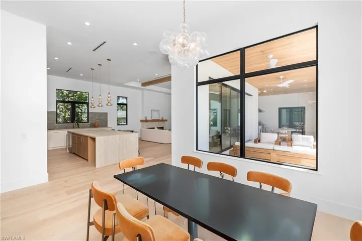 Dining room featuring recessed lighting, light wood-style flooring, visible vents, and a chandelier