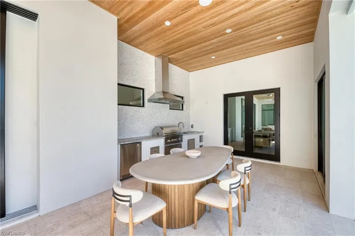 Dining room featuring recessed lighting and wood ceiling