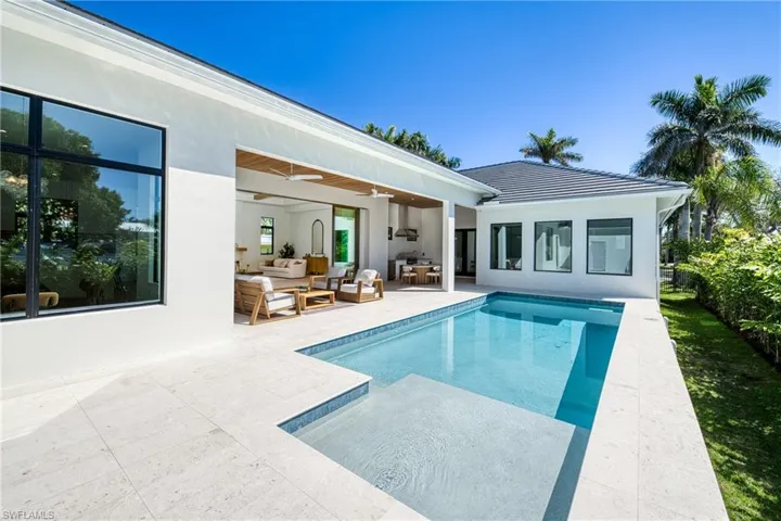 Outdoor pool featuring an outdoor hangout area, fence, a ceiling fan, and a patio area