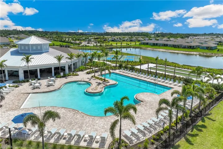 Community pool featuring a residential view, a patio, and a water view