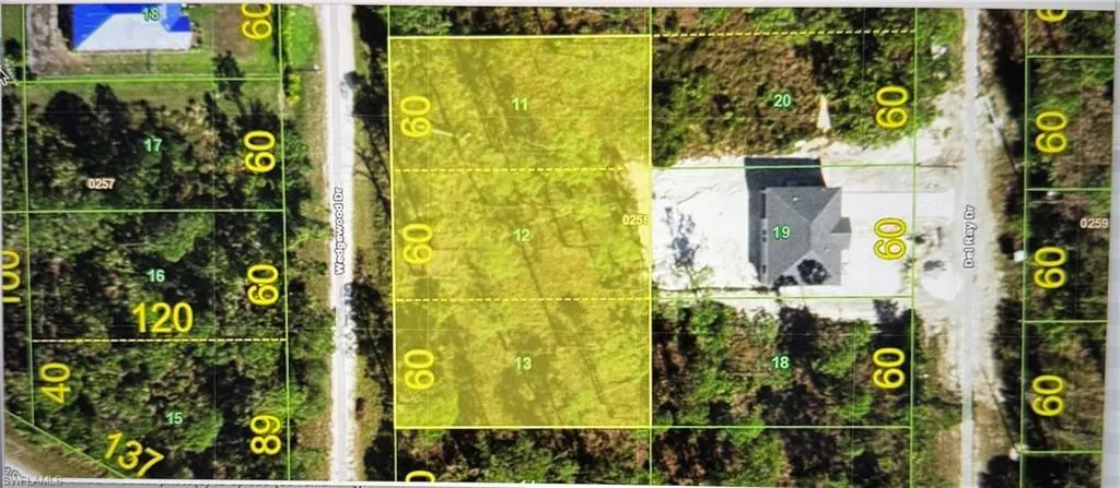 Aerial map of property and surrounding area featuring property parcel outlined