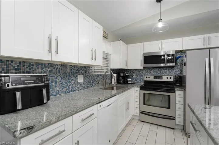 Kitchen w/granite tops