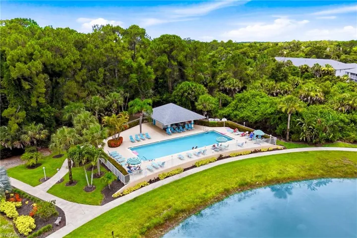 Enjoy multiple resort-style amenities with this aerial view highlighting an additional community swimming pool just moments from your home.