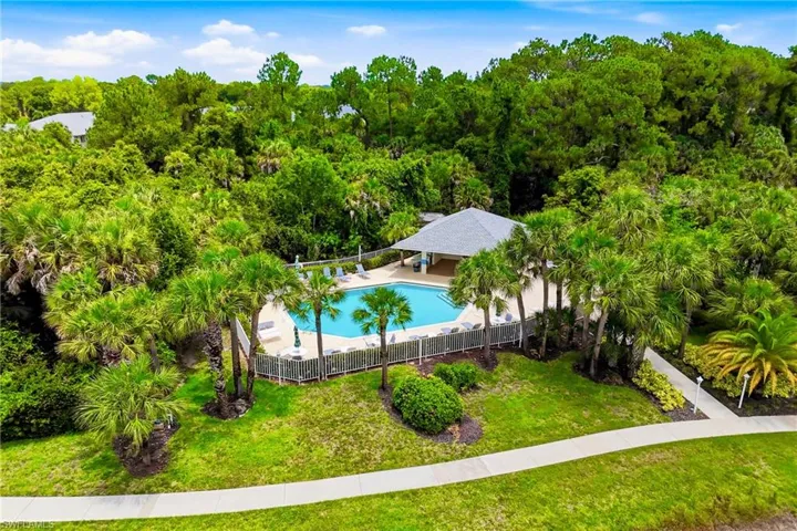 Elevated view of the community's additional pool, surrounded by mature landscaping and designed for year-round enjoyment.