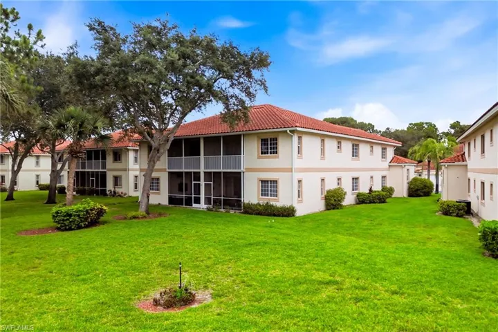 Covered lanai at the back of the home overlooks tranquil water views, ideal for enjoying Florida sunsets.
