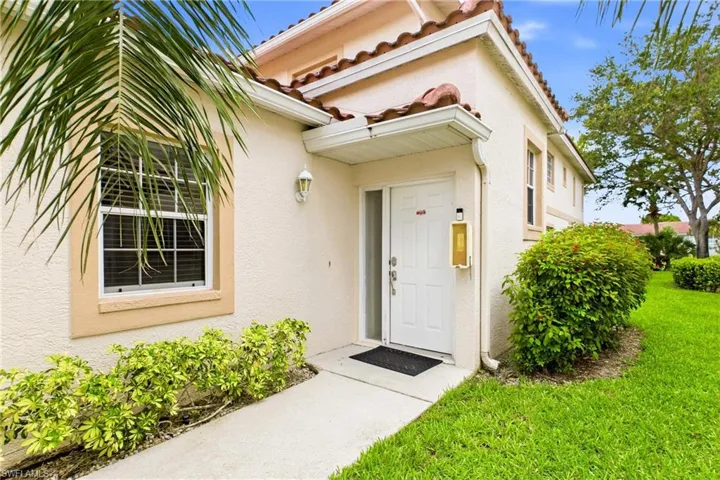 Inviting front entrance welcomes you into this spacious Naples condominium.