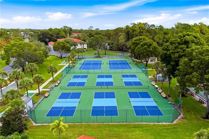 Aerial view showcasing the community's impressive recreational amenities, including pickleball, tennis, and shuffleboard courts.