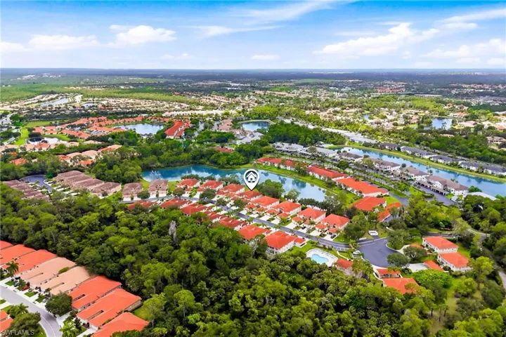 Bird's-eye view showcases the beautiful setting of this residence within the highly desirable Sapphire Lakes community.