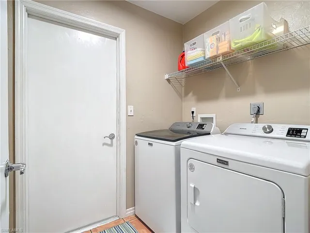 Laundry room / mud room inside residence with access to garage.