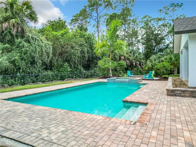 View of swimming pool with a patio area