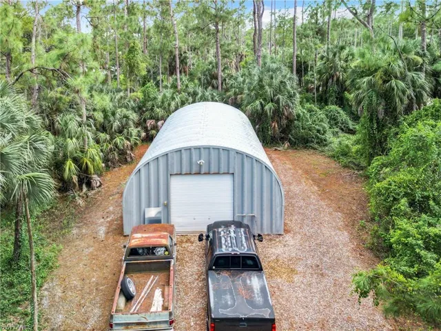 View of outdoor structure with a garage