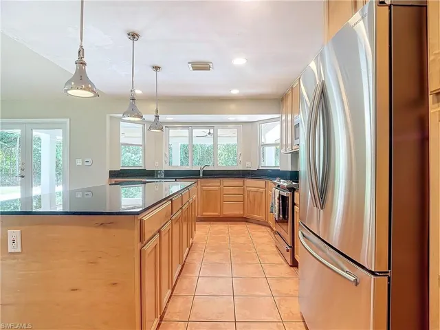 Kitchen with french doors, stainless steel appliances, and plenty of natural light