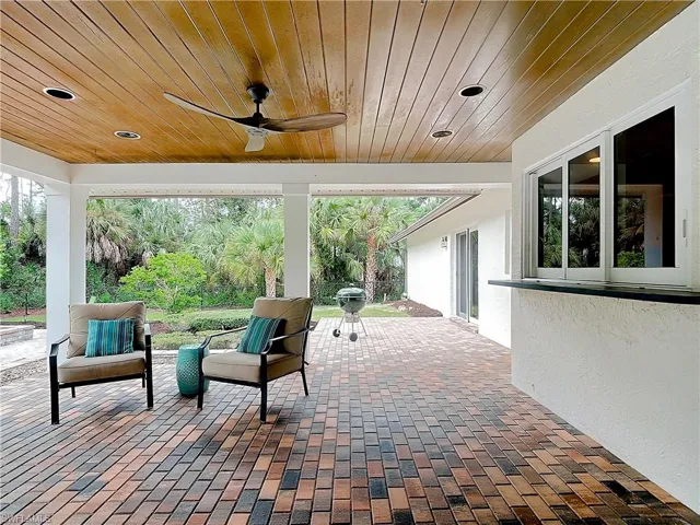 View of patio with wood ceiling, recessed lighting & ceiling fan