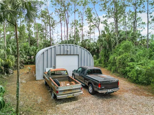 42ft x 25ft Quonset Hut steel out-building with concrete slab and electric.