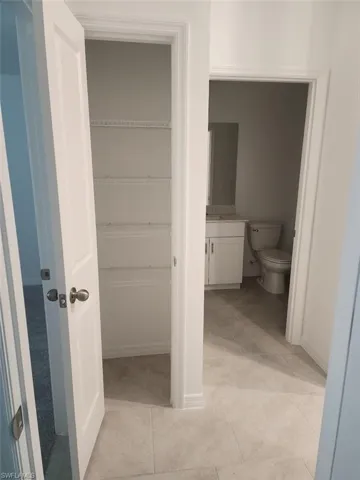 Bathroom featuring vanity and light tile patterned floors