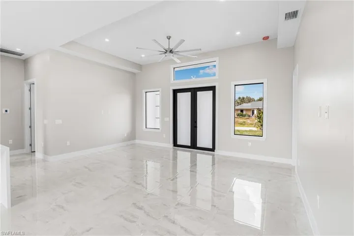 Foyer with french doors and ceiling fan