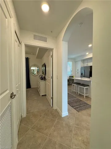 Hall with light tile patterned floors
