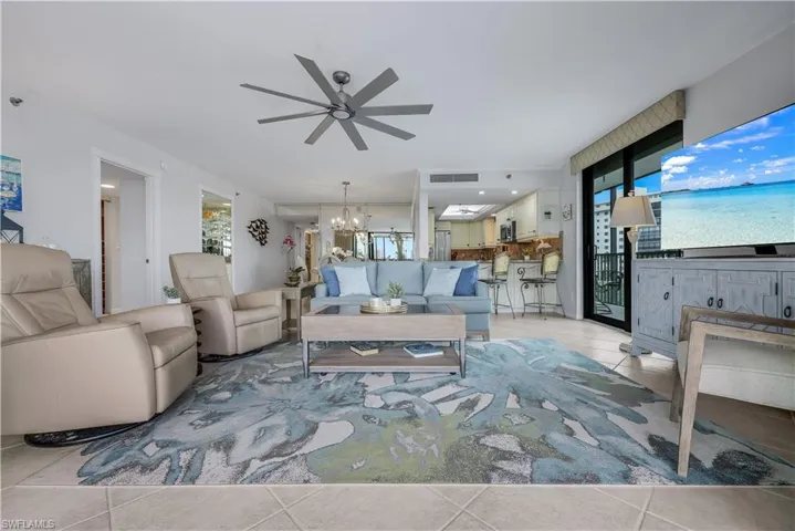 Tile flooring throughout, recessed lighting, and a modern ceiling fan