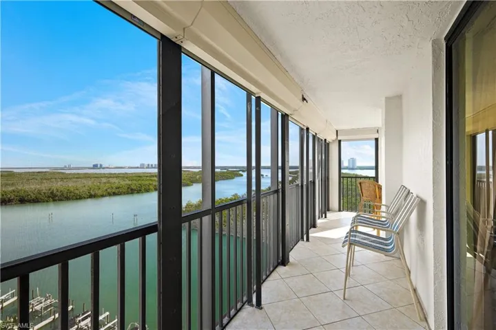 Expansive balcony with tiled flooring and a metal railing