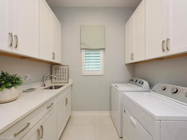 Large laundry room with lots of closets.
