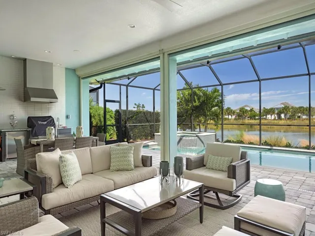 Almost 1,000 square feet of covered lanai with large seating area, dining area and summer kitchen.