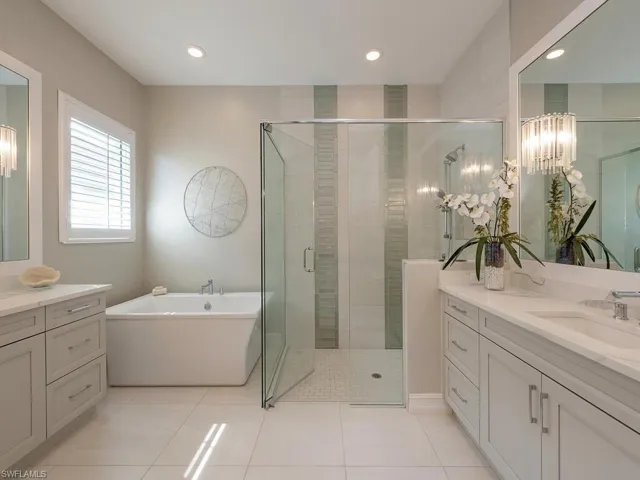 Master bath with dual vanities and oversized shower and soaking tub.