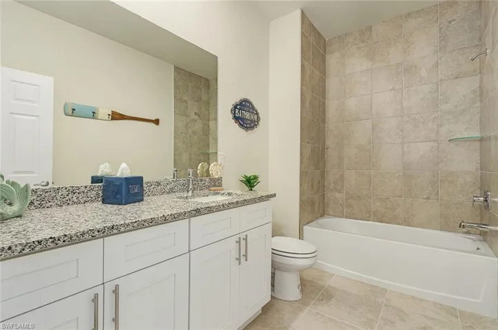 Bathroom featuring vanity and shower / bath combination