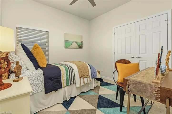 Bedroom featuring a closet and ceiling fan