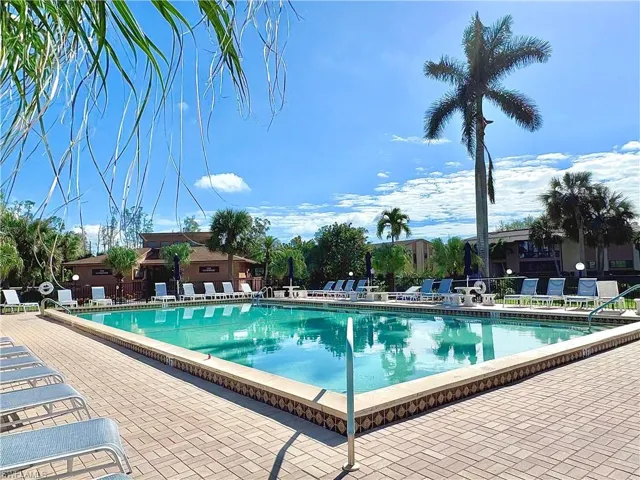Community pool featuring a patio