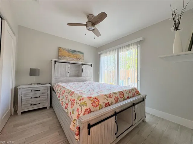 Bedroom with light wood-type flooring and ceiling fan
