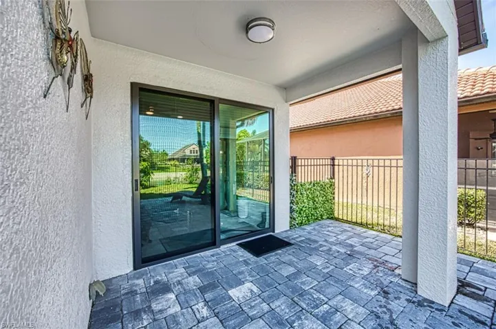 Doorway to property with a patio