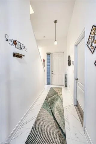 Entryway featuring light tile flooring