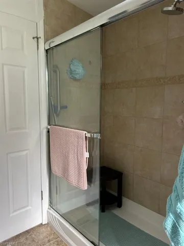 Bathroom with Tile shower with glass door