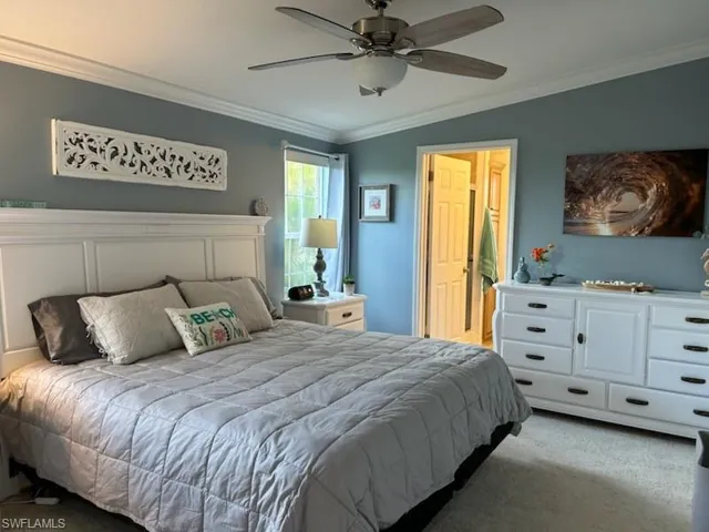 Primary Bedroom, crown molding, and vaulted ceiling