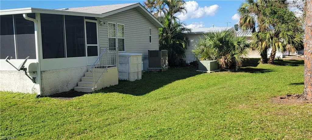 View of yard with a sunroom