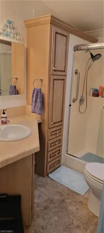 Guest Bathroom with linen closet and walk in shower