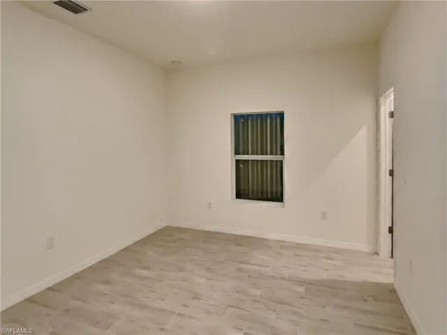 photo is of a previously completed home  View of empty room