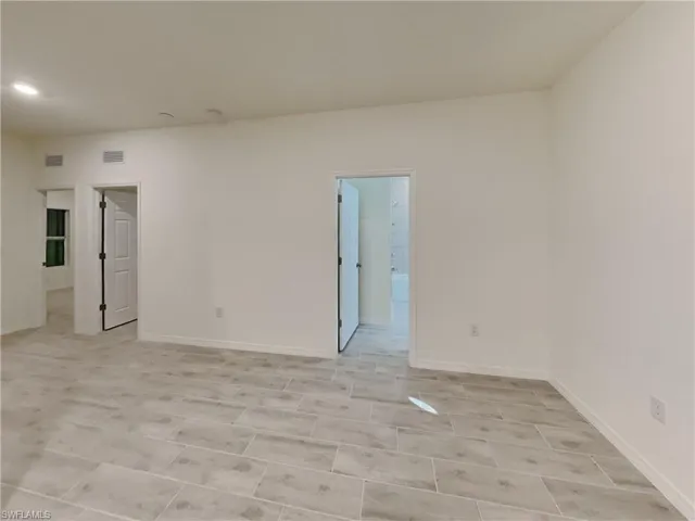 photo is of a previously completed home  View of unfurnished room